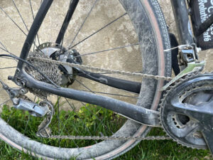 A closeup of Jason's bicycle wheel showing its battle scars