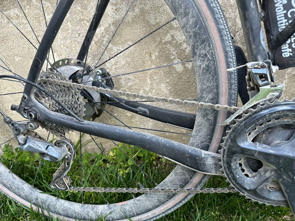 A closeup of Jason's bicycle wheel showing its battle scars